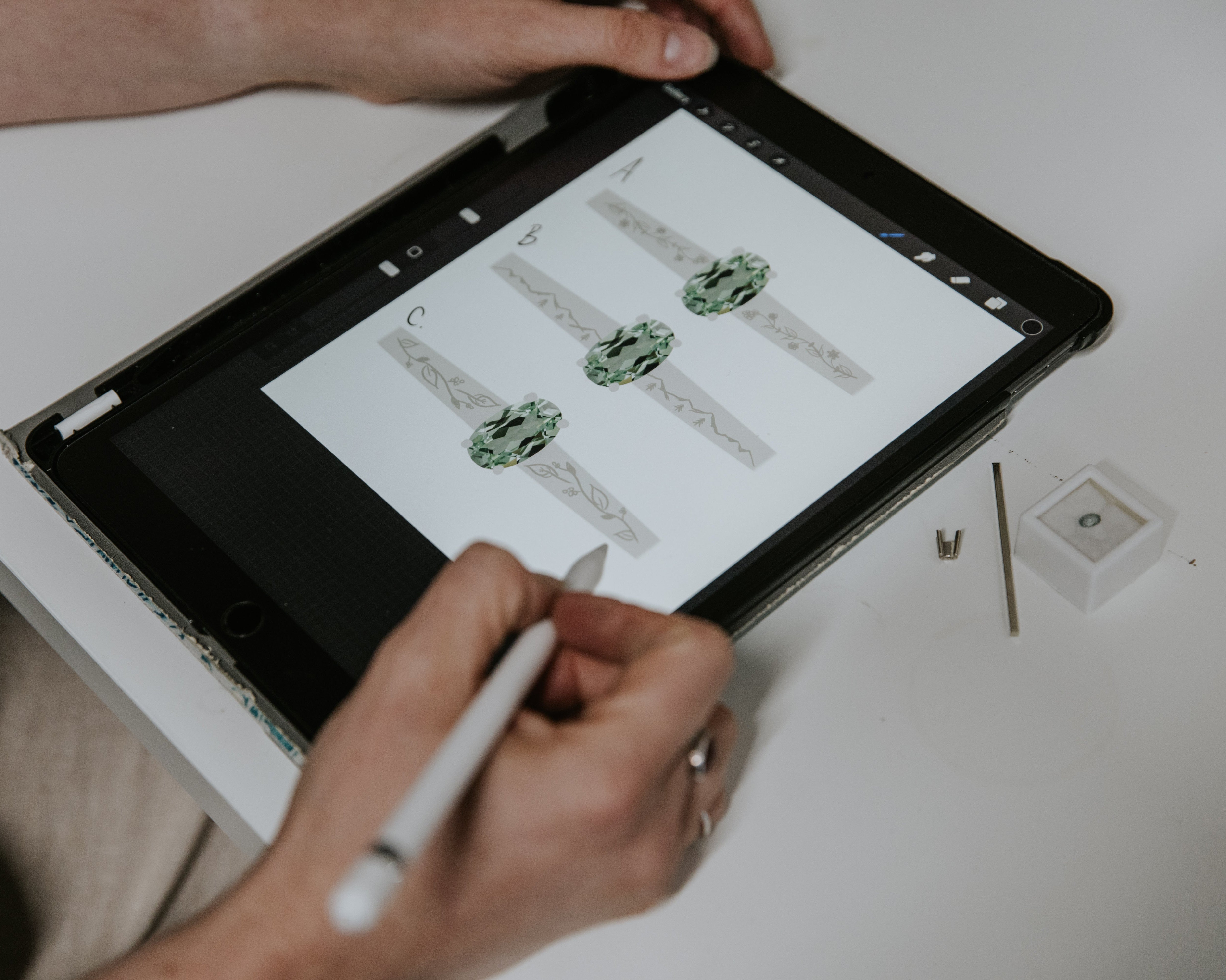 hand sketched engagement ring with green sapphire