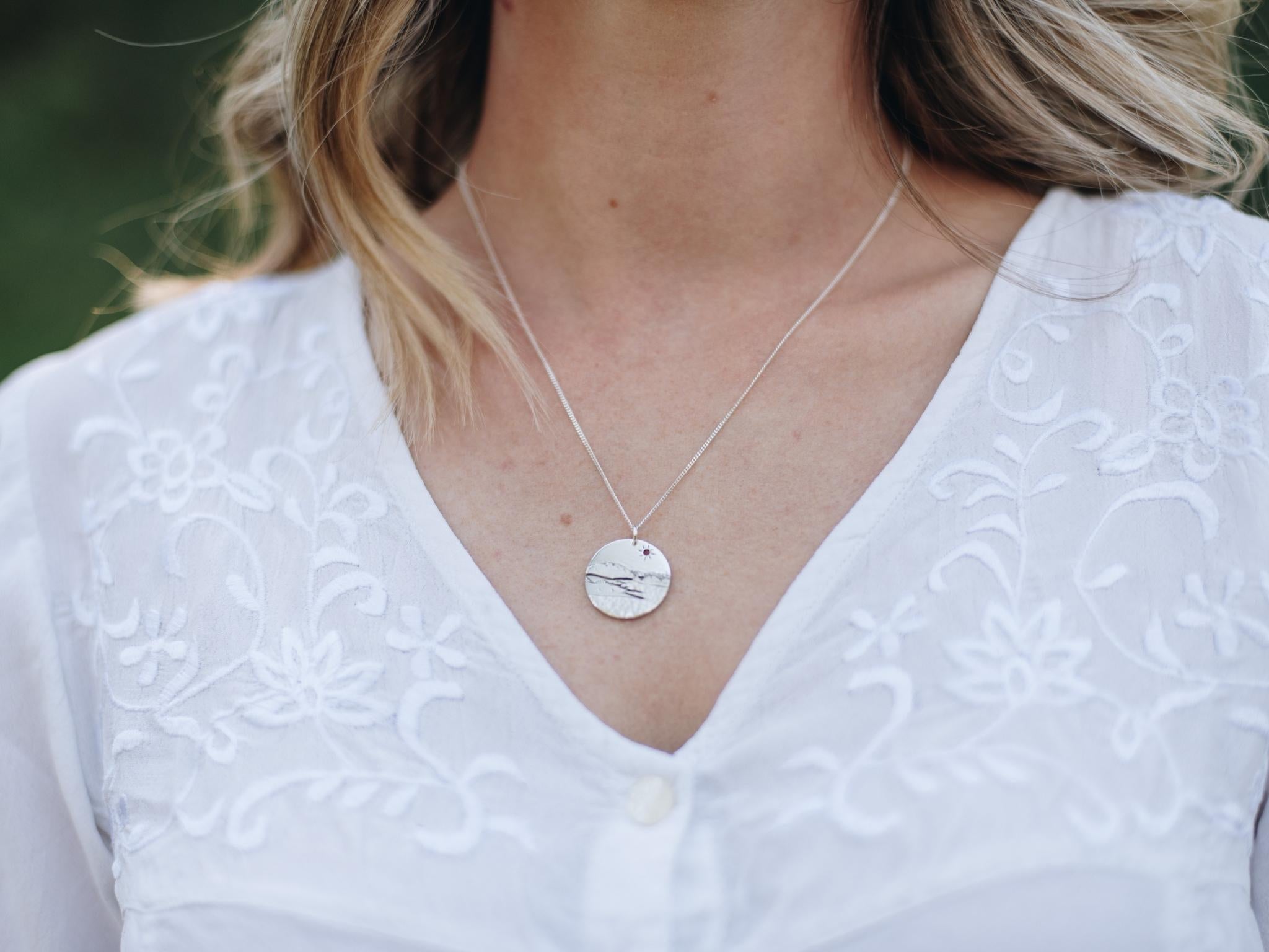Sterling silver Kelowna BC pendant with mountains, okanagan lake and the iconic bridge.