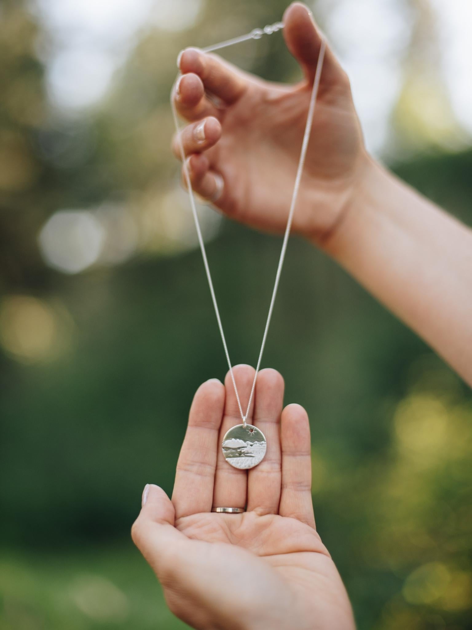 Sterling silver Kelowna BC pendant with mountains, okanagan lake and the iconic bridge.