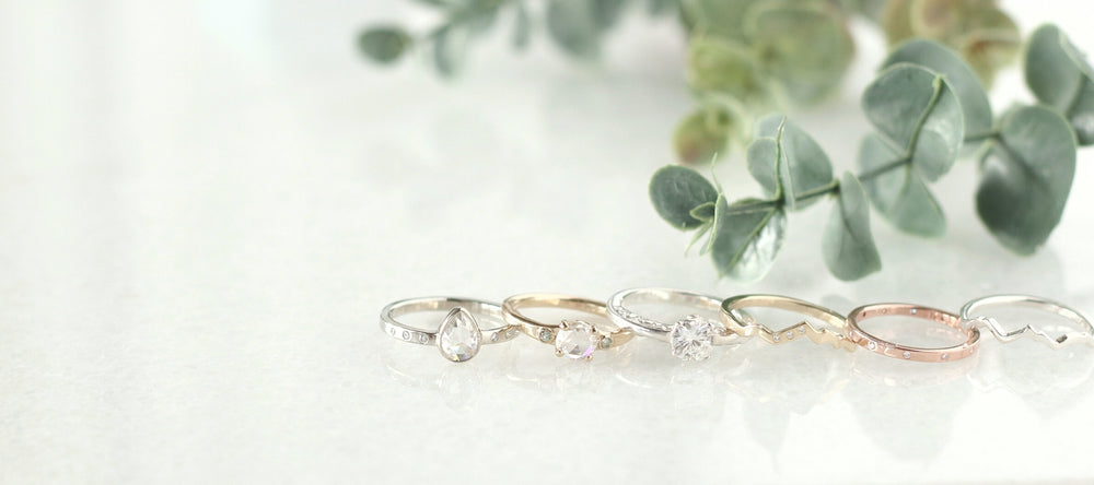Group photo of Scenic Route Jewellery's personalized engagement and wedding rings in certified recycled gold.