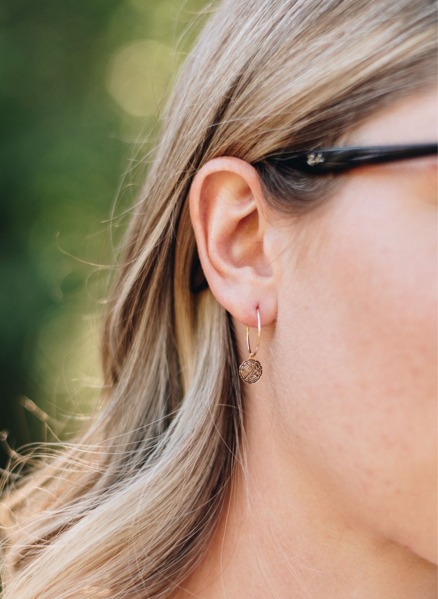 Rose gold-filled wire hoops with tree slice charms.