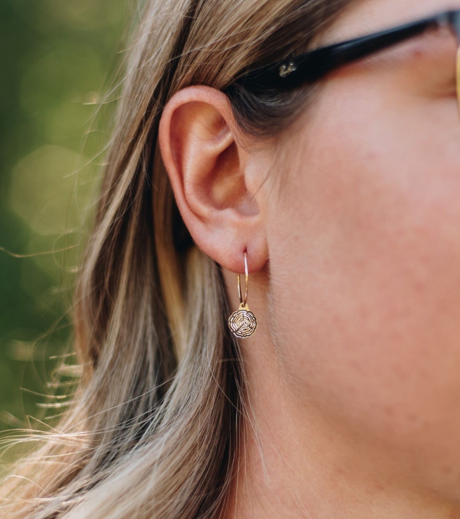 Yellow 14k gold-filled wire hoops with tree slice charms.