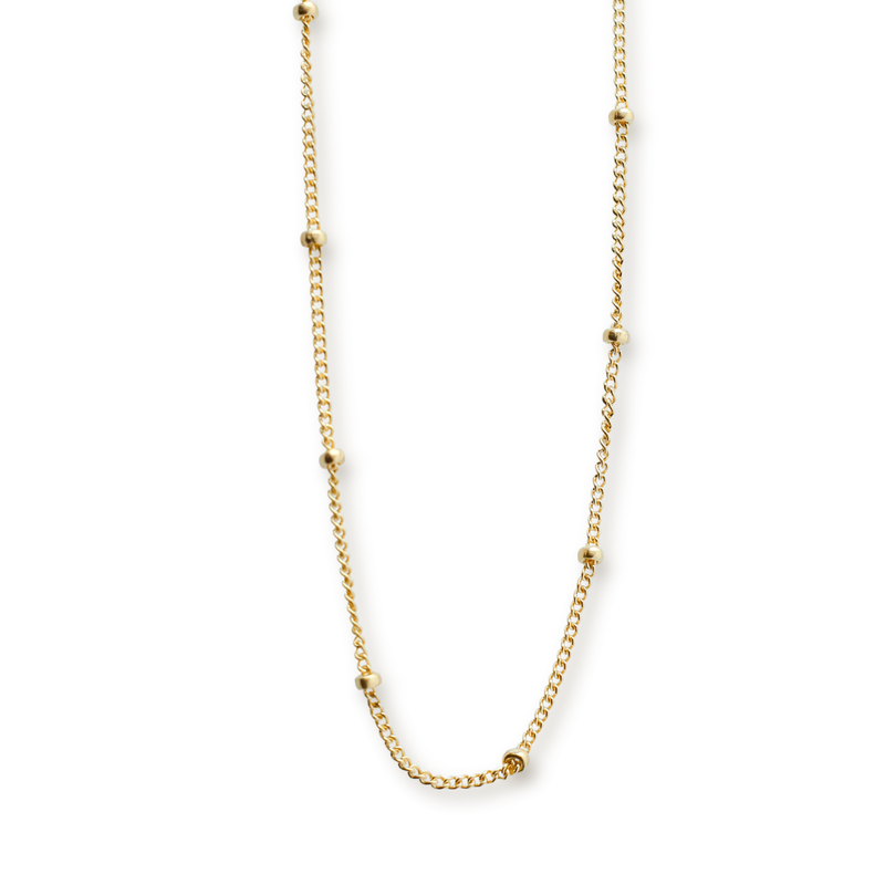 delicate yellow gold beaded chain on transparent background