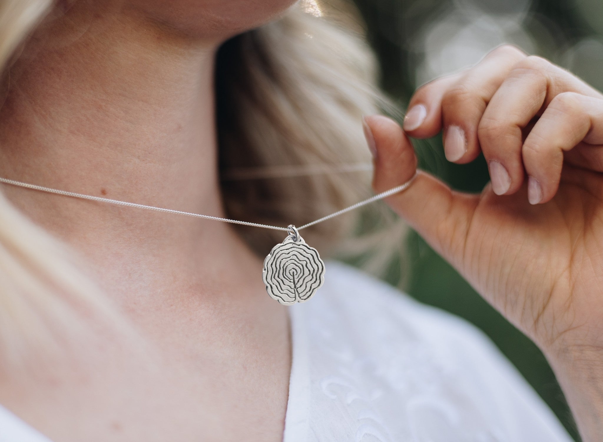 tree slice necklace in sterling silver. Handmade in Canada