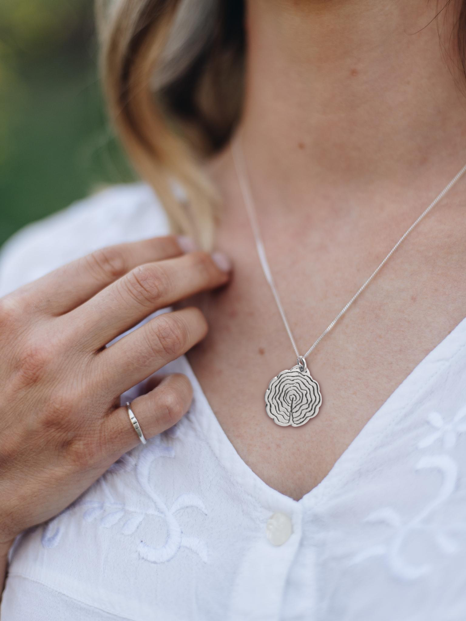 tree slice necklace in sterling silver. Handmade in Canada