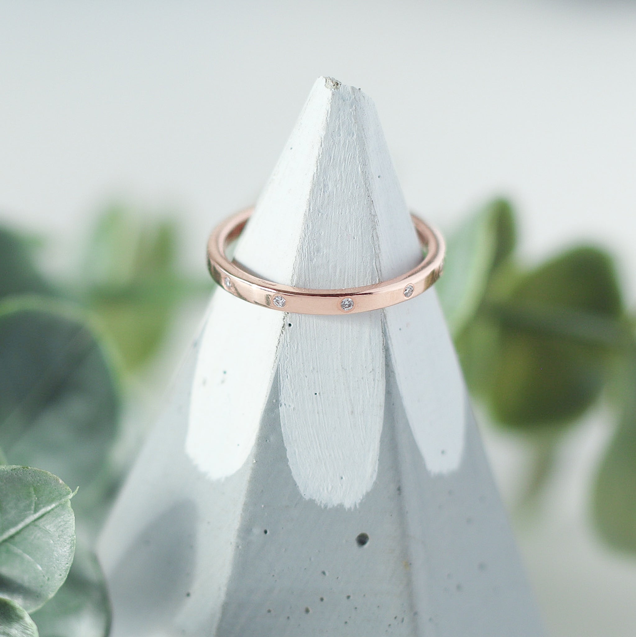 Rose gold diamond eternity ring with 12 lab-grown diamonds.