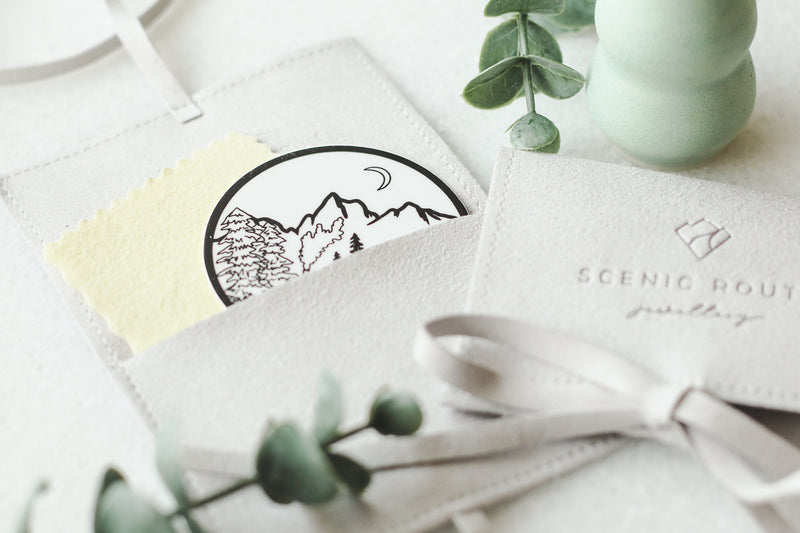 Scenic Route Jewellery packaging with mountain vinyl sticker and polishing cloth.