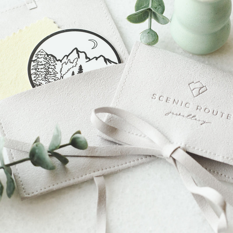 Scenic route jewellery packaging with polishing cloth and vinyl sticker
